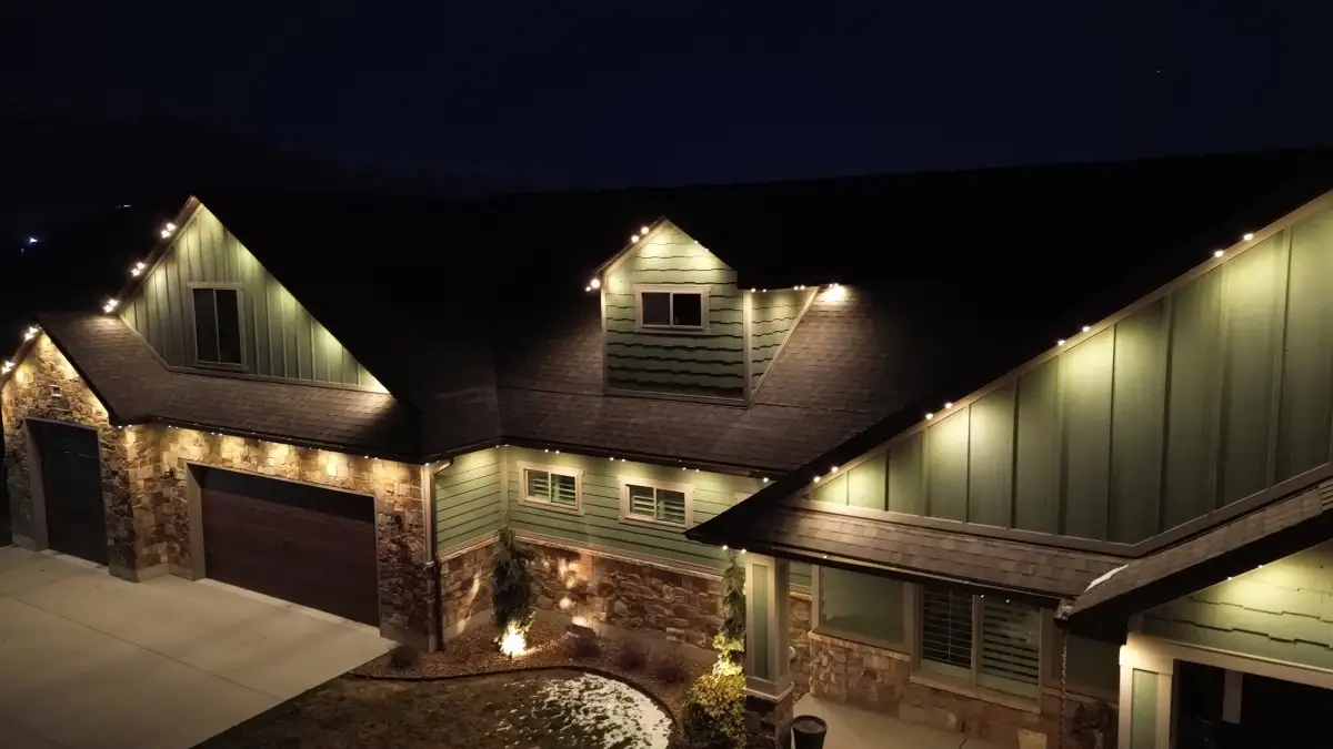 Custom landscape lighting illuminating trees and pathways on a Camden SC property