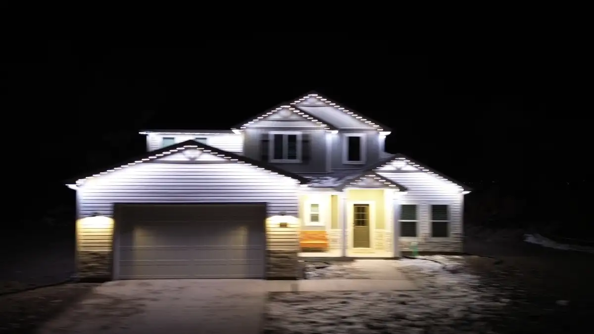 Security lighting illuminating dark zones around a home